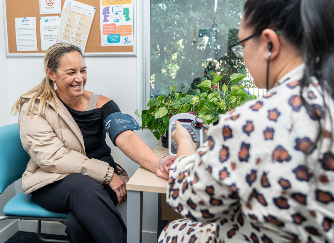 GP and patient blood pressure test