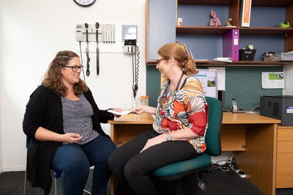 Dr Ros Wall speaks to a pregnant patient