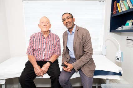 GP consults with older person